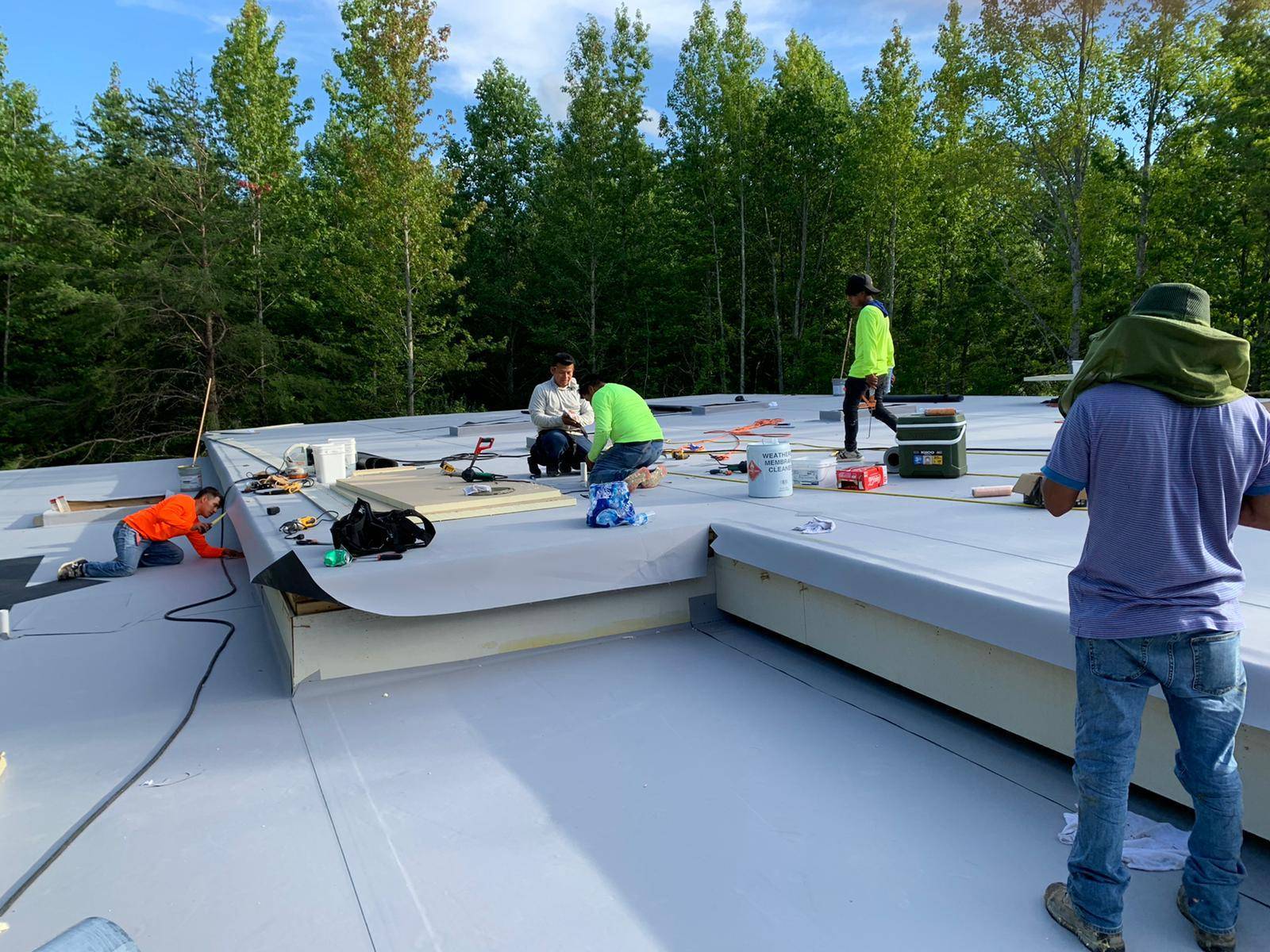 Roof specialists installing TPO roof