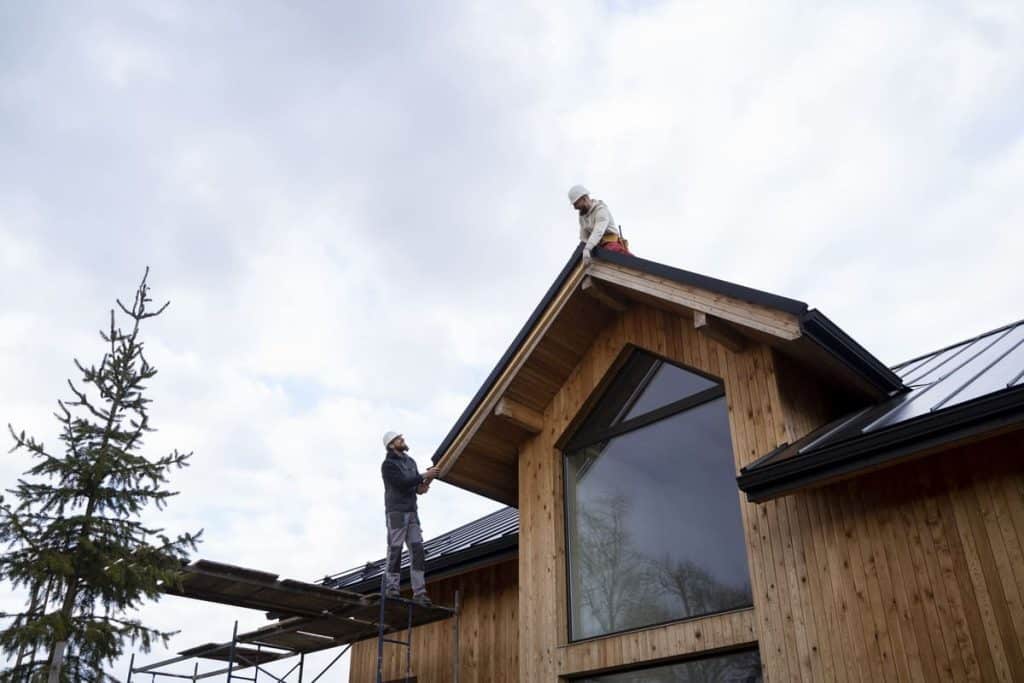 Two men installing roof