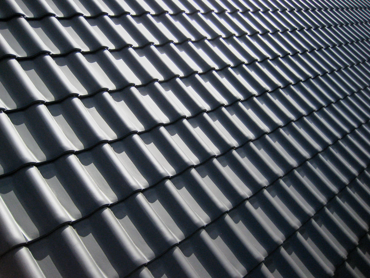 Roofline and shingle edge where gutters protect the home from water damage
