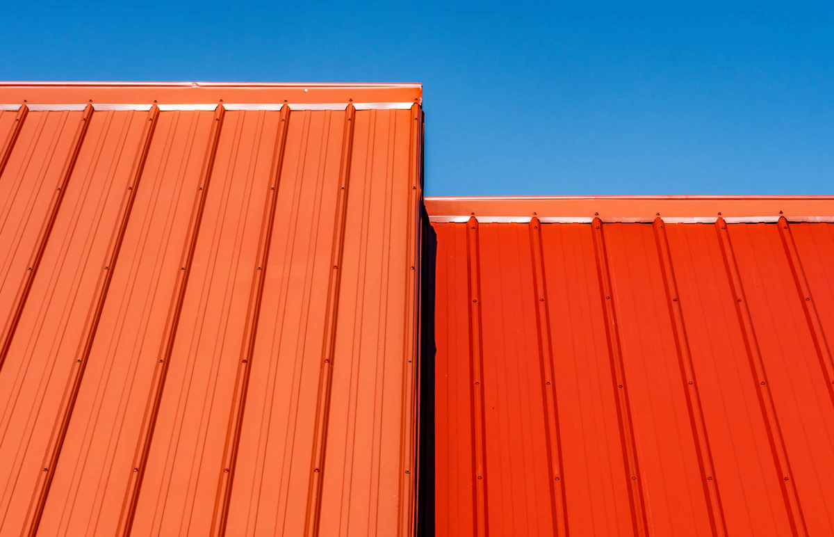 Standing seam metal roof panels on a home under a blue Middle Tennessee sky